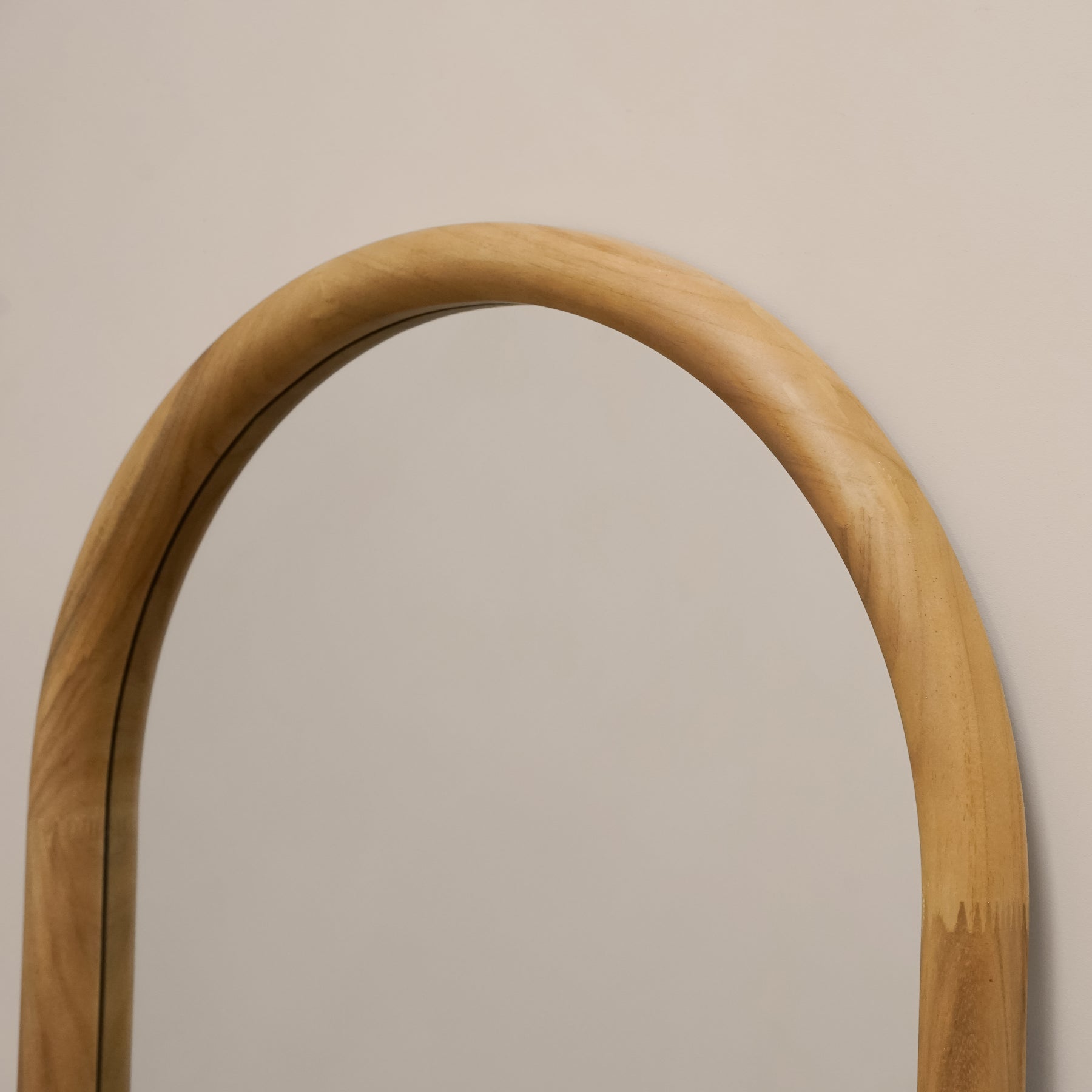 Closeup of Full length large arched natural mirror