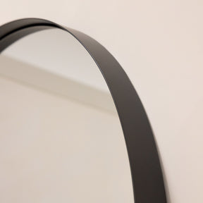 Full length arched black extra large metal mirror closeup