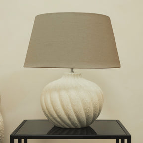 Textured ceramic based table lamp beige shade on brookyln table