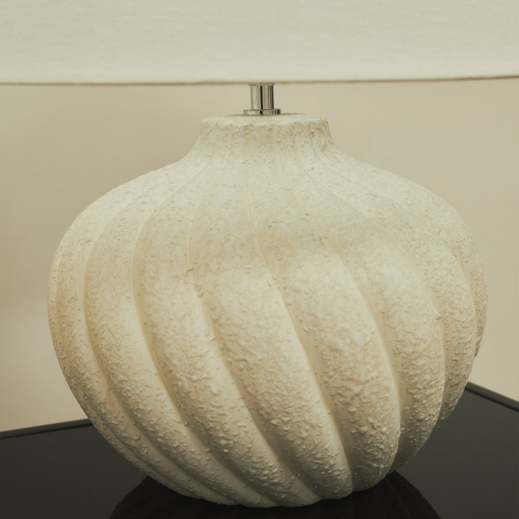 Textured ceramic based table lamp natural shade detail shot