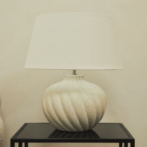 Textured ceramic based table lamp natural shade on brookyln side table