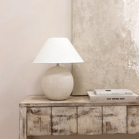 Stone ceramic coolie shade table lamp with books