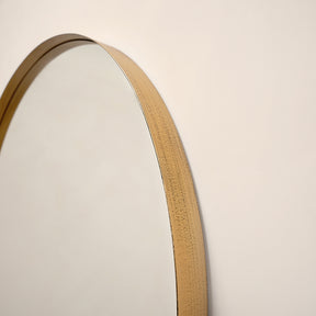 Closeup of Full length arched gold XXL vintage metal mirror