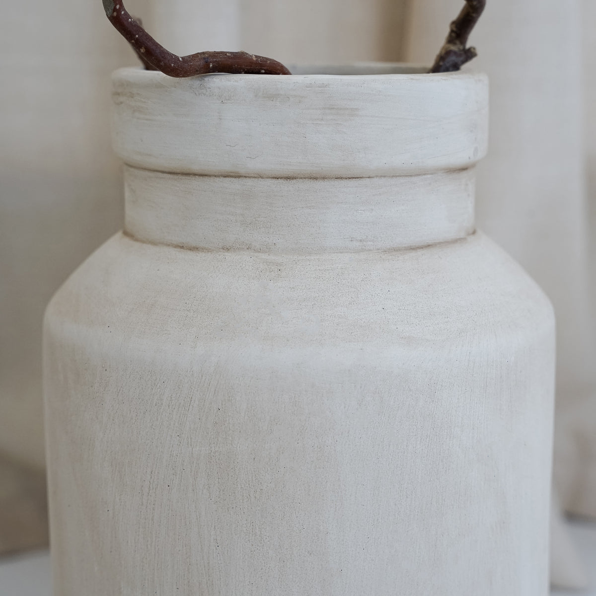 Beige textured ceramic small vase detail shot