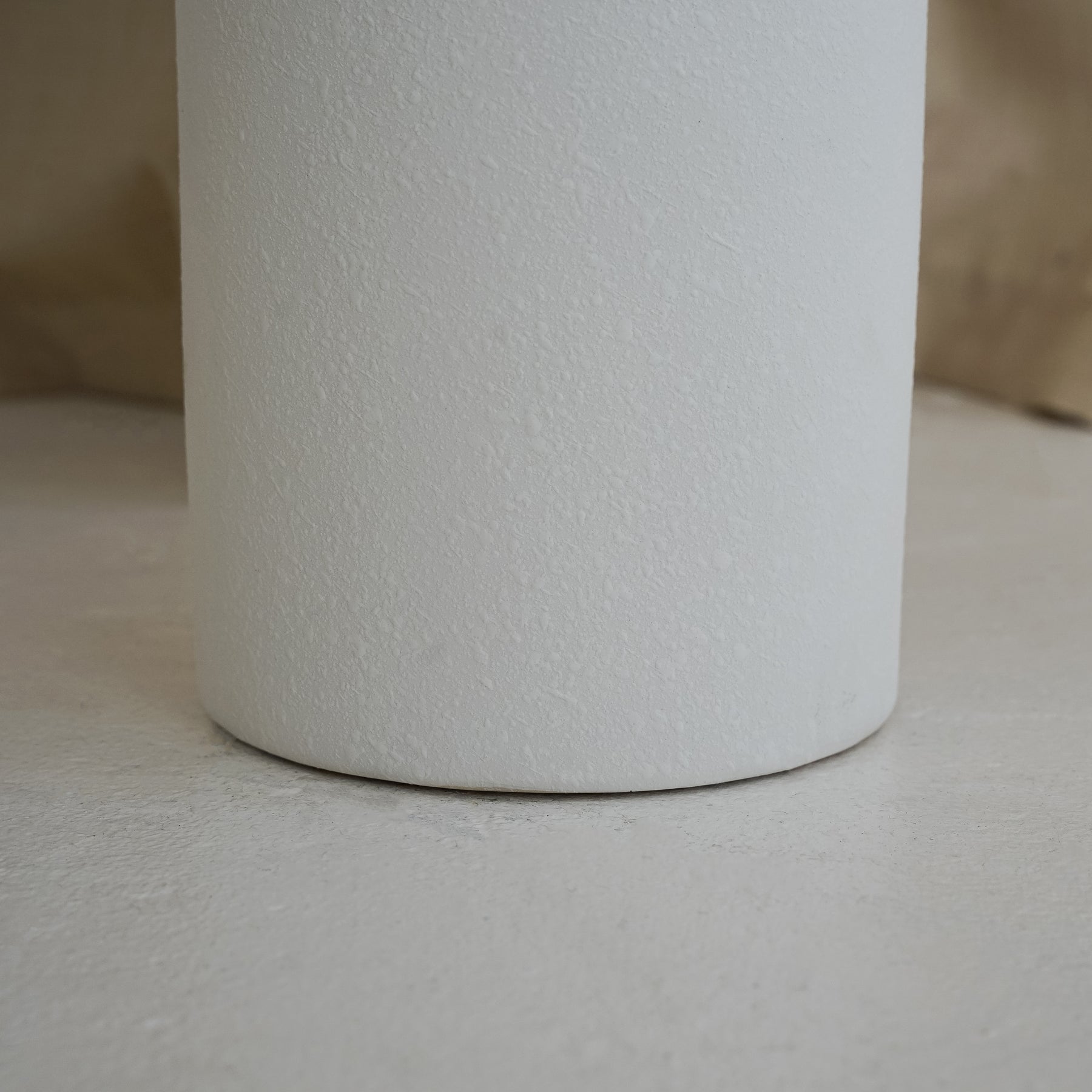 White textured ceramic small vase detail shot of base