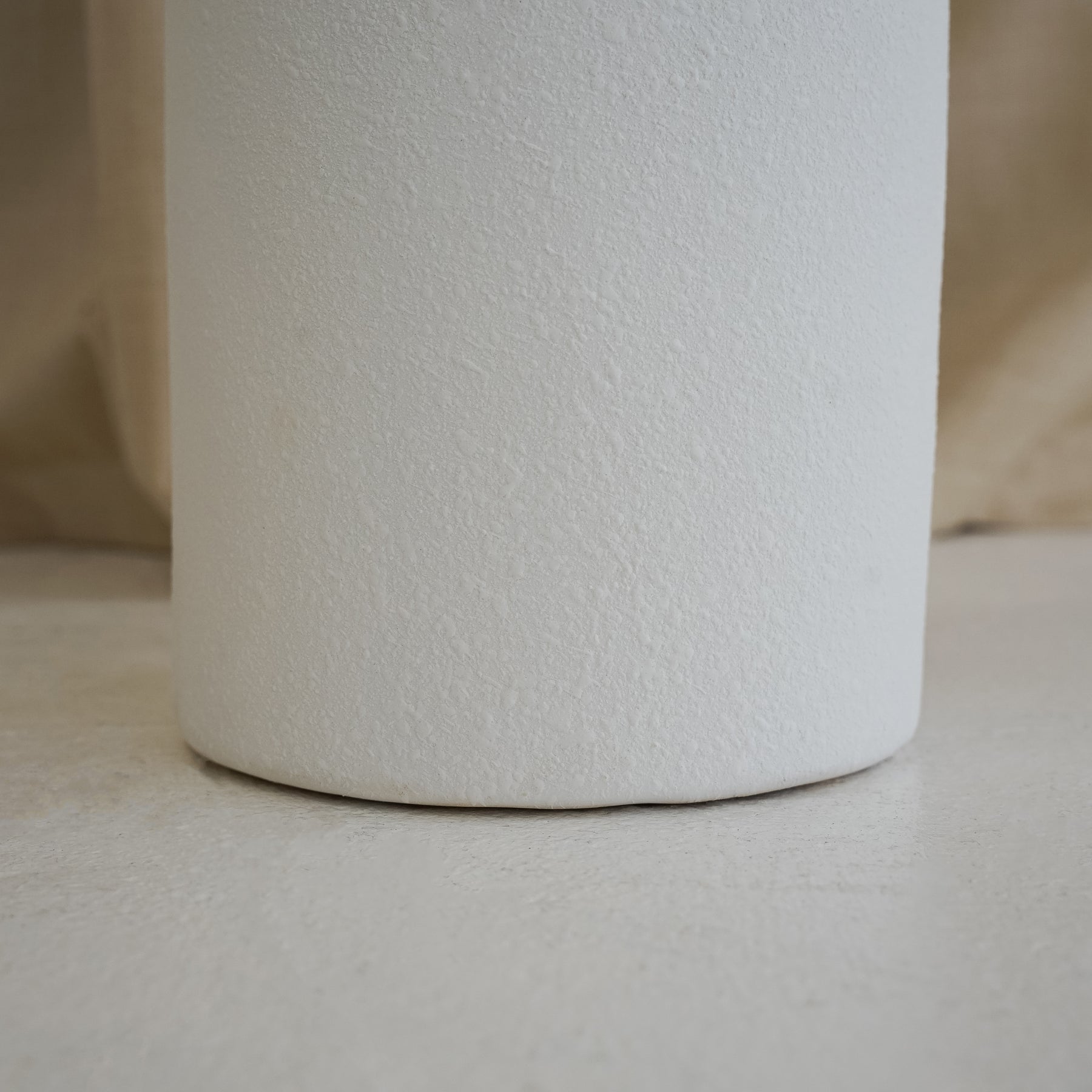 White textured ceramic large vase detail shot of base