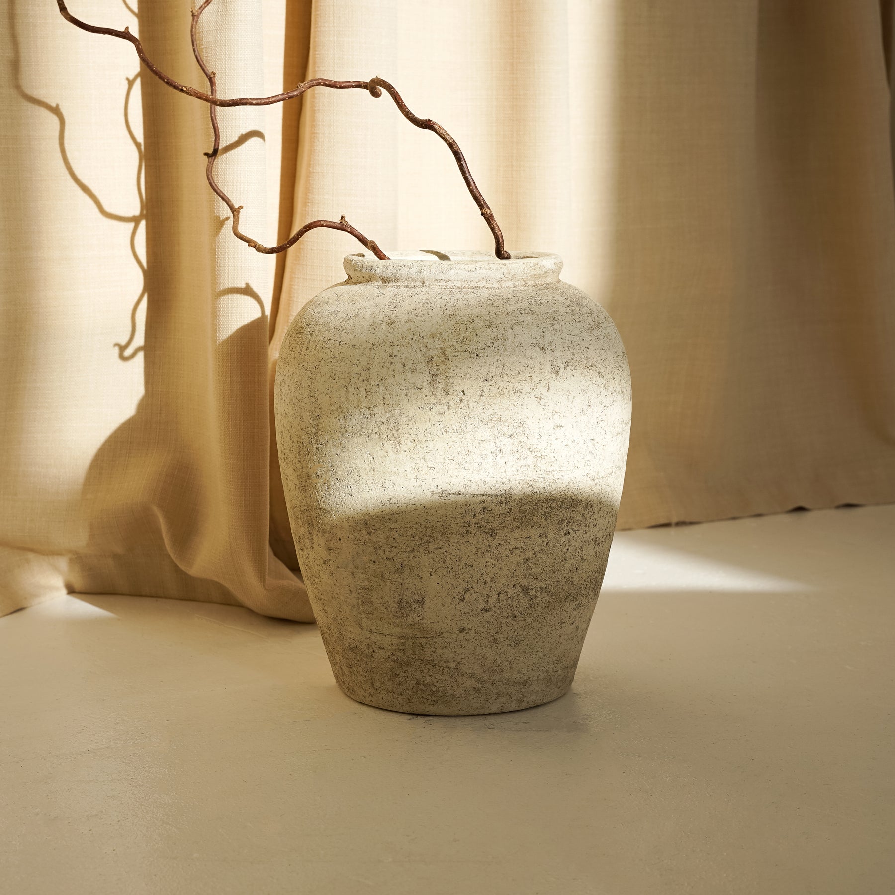 Beige Textured Terracotta Small Vase in natural lighting