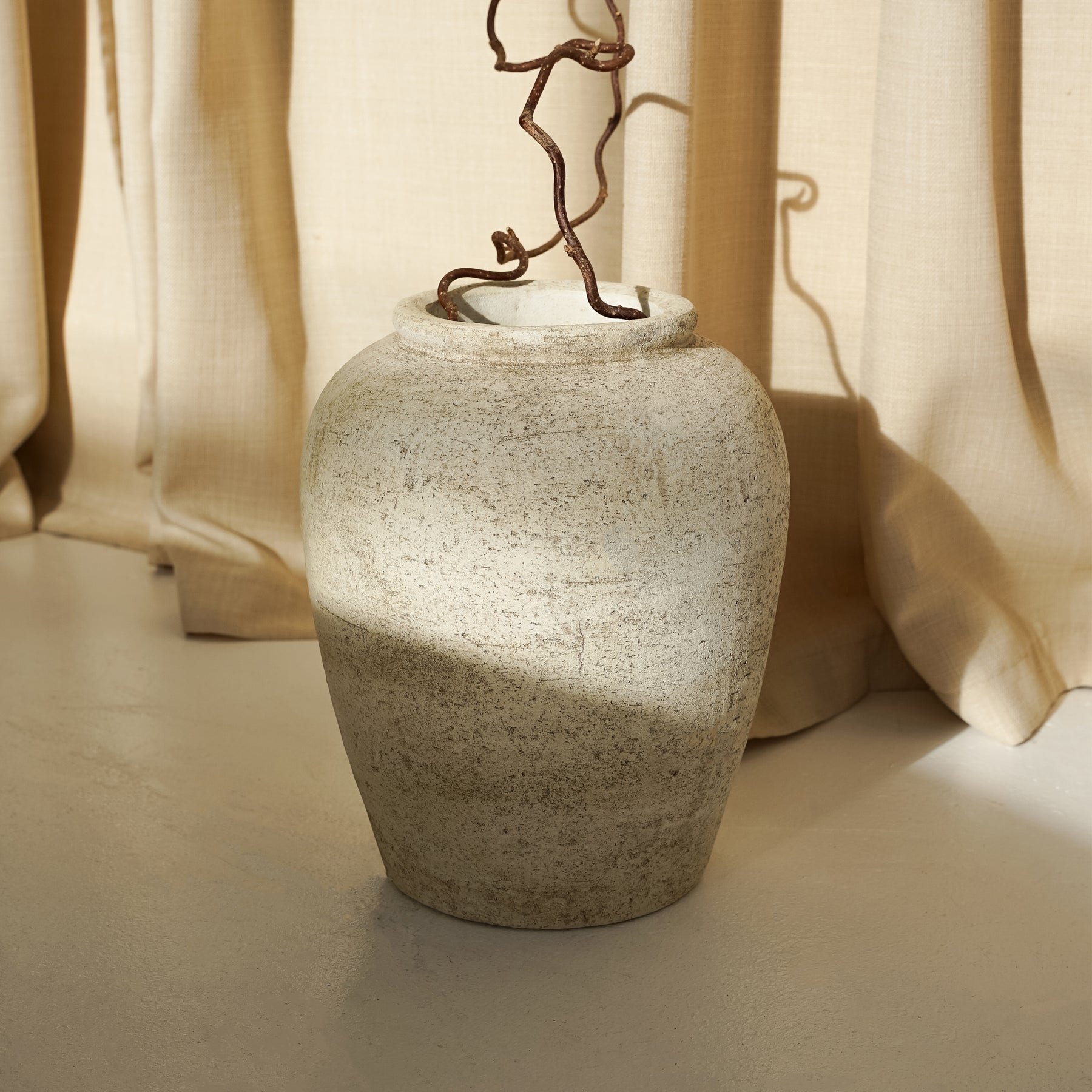 Beige Textured Terracotta Small Vase with fabric background