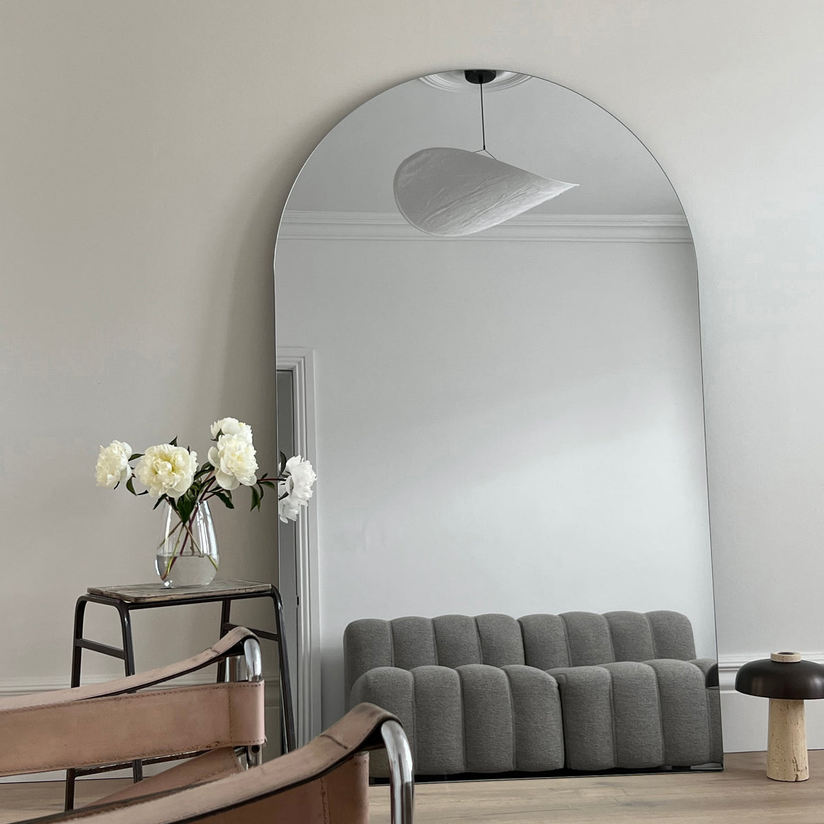 Extra large frameless arched full length mirror in lounge