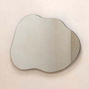 Small Framelsss Pond Mirror displayed on wall