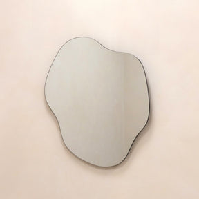 Medium Frameless Pond Mirror hanging on wall