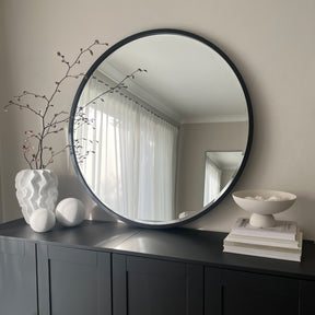 Black Metal Modern Round Wall Mirror on console table