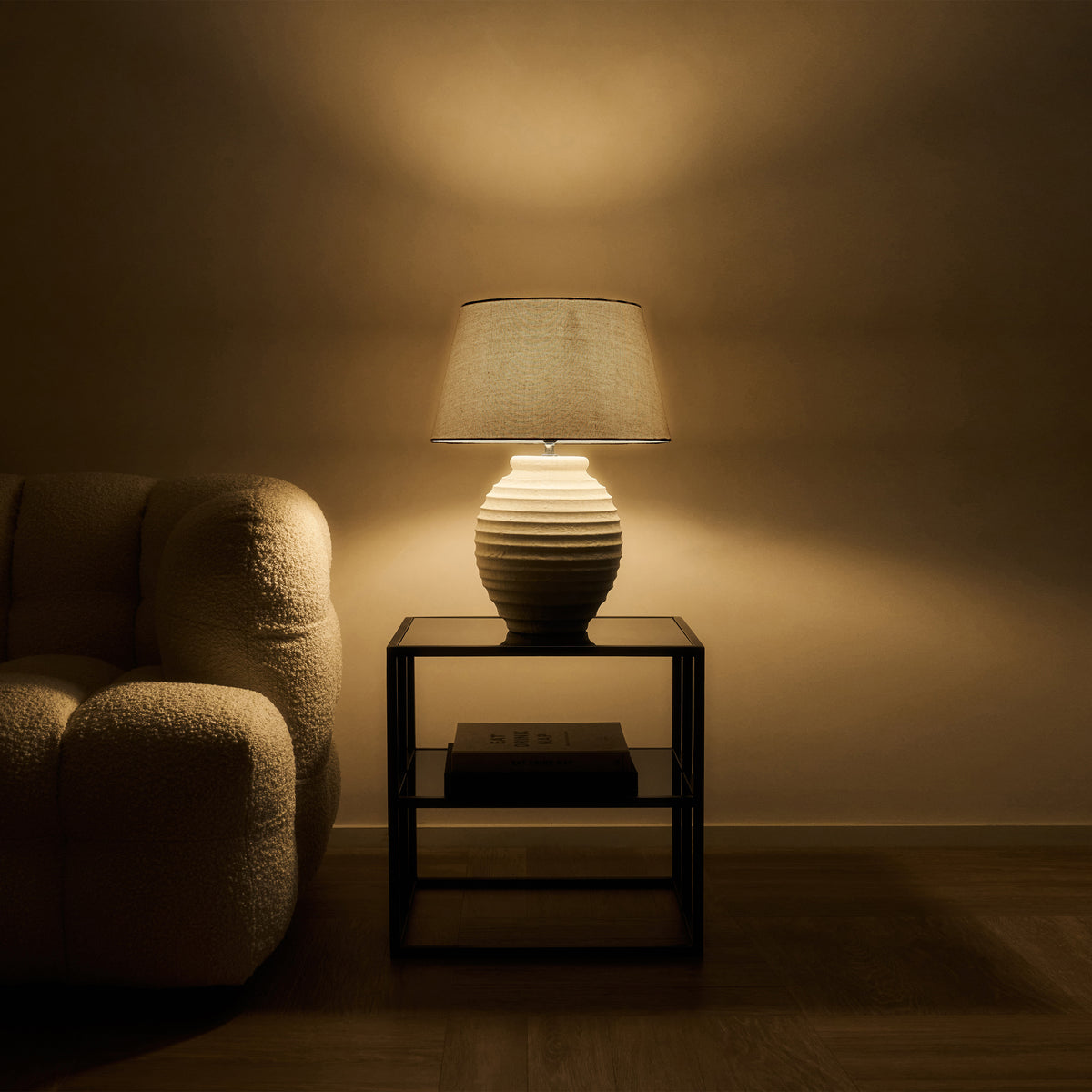 Textured Ceramic Based Table Lamp Beige Shade emitting warm lighting