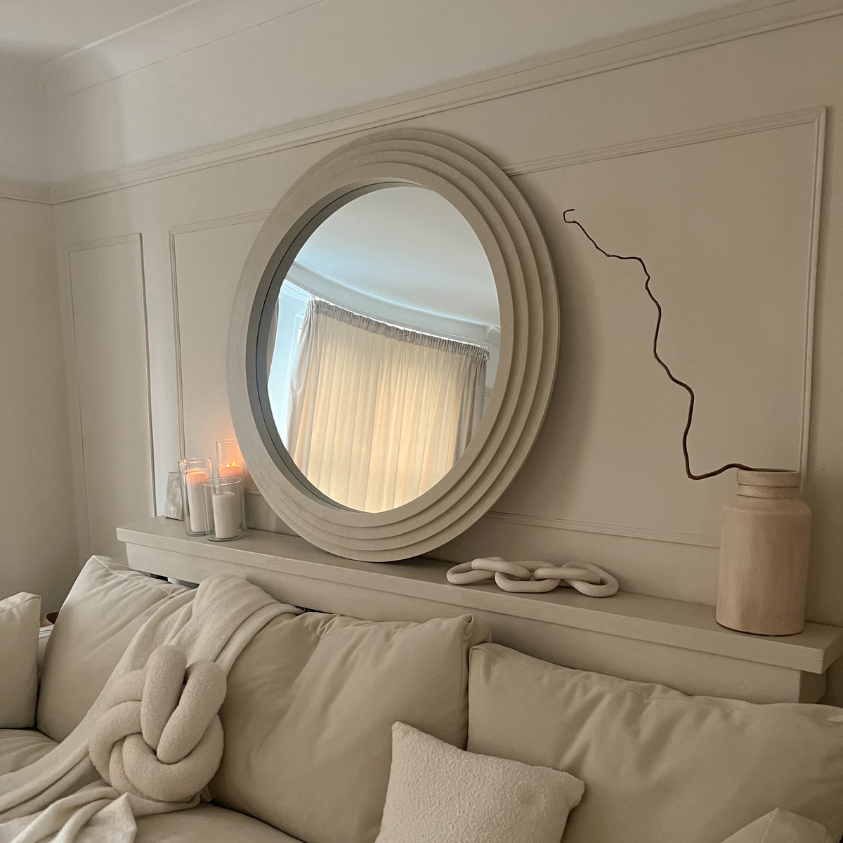 Round Concrete Wall Mirror above bed