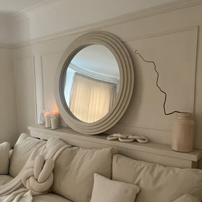 Round Concrete Wall Mirror above bed