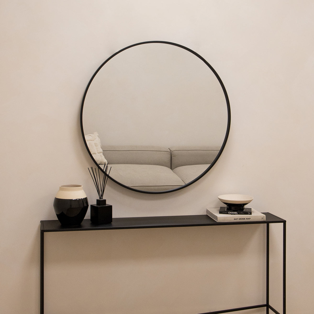 Black Metal Industrial Round Wall Mirror above console table