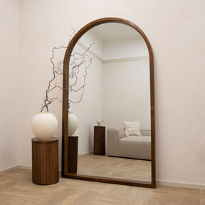Full Length Extra Large Arched Walnut Mirror beside pedestal