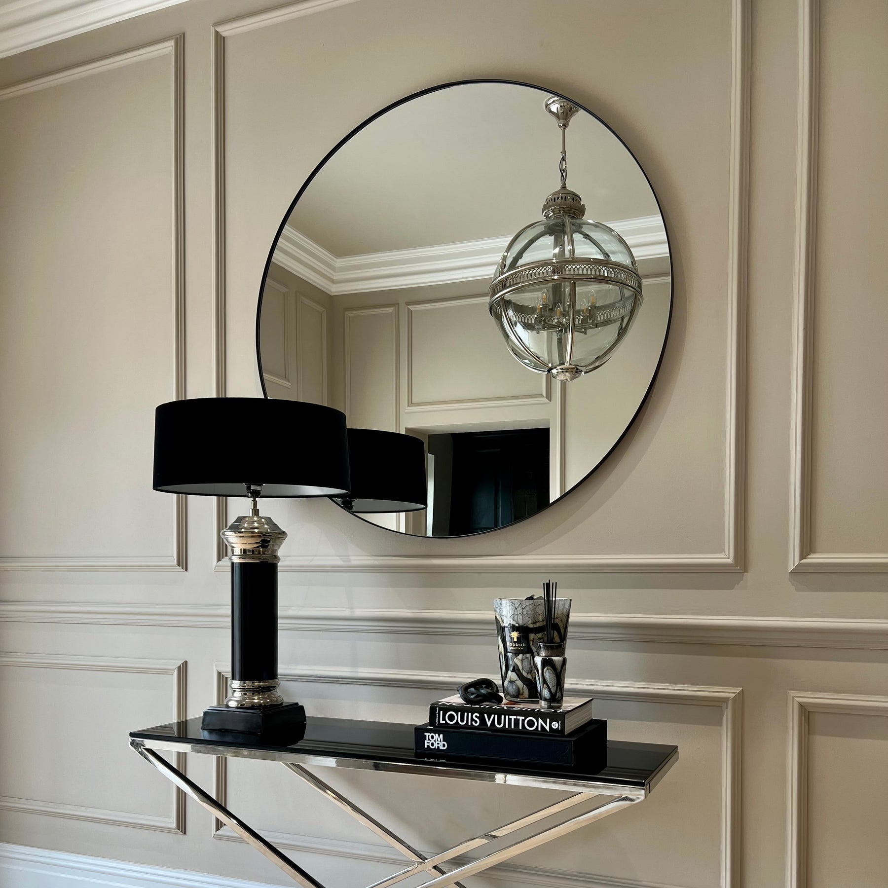 Black Round Metal Extra Large Wall Mirror reflecting chandelier