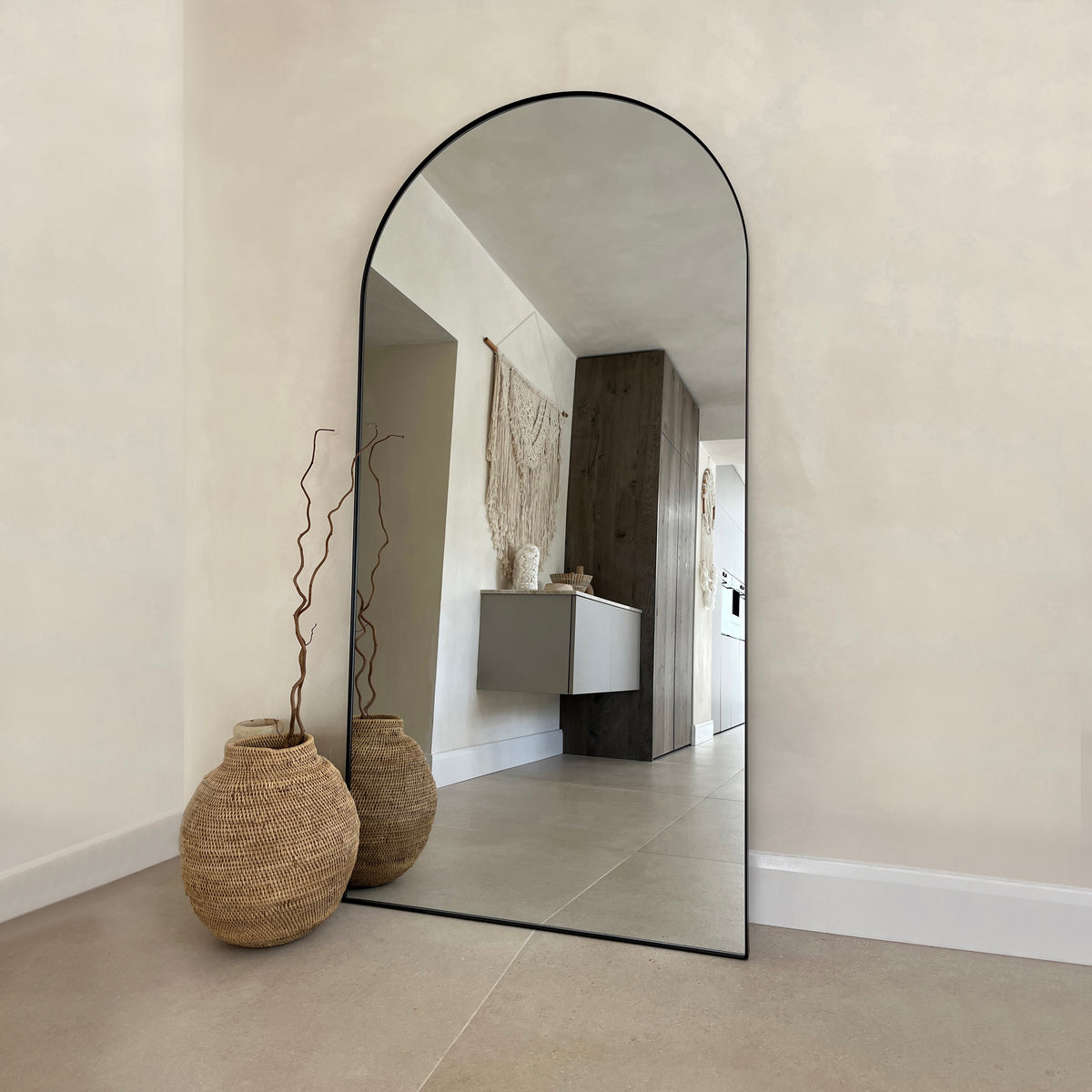 Full Length Black Arched Large Metal Mirror leaning against wall