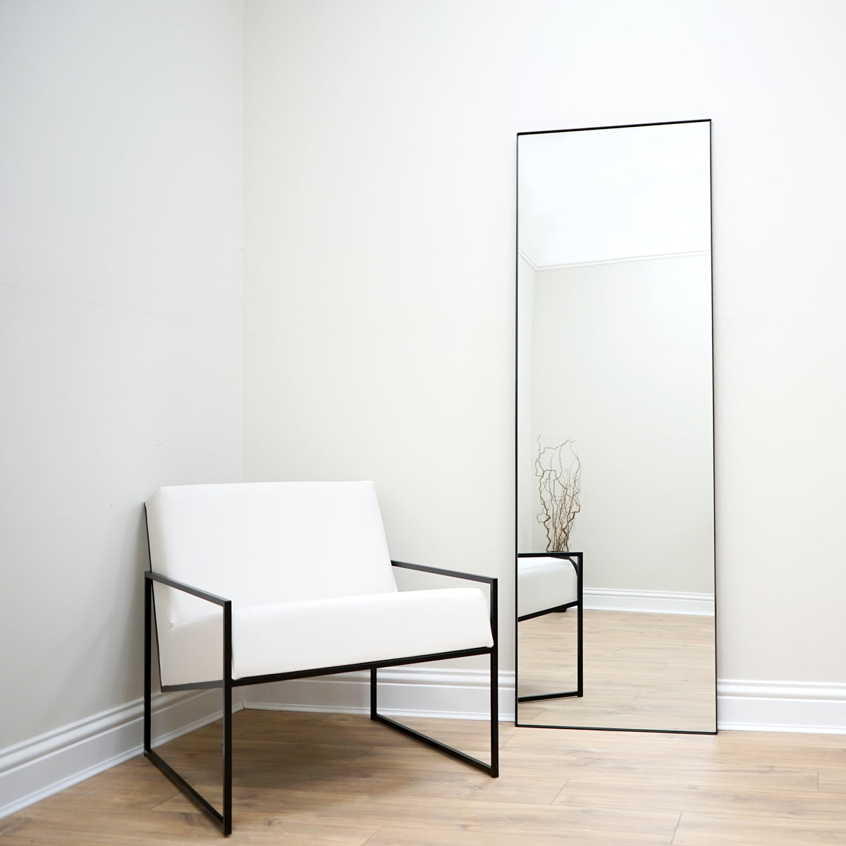 Full Length Black Rectangular Large Metal Mirror beside chair