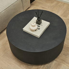 Closeup of Large minimal onyx round coffee table displayed with sofa