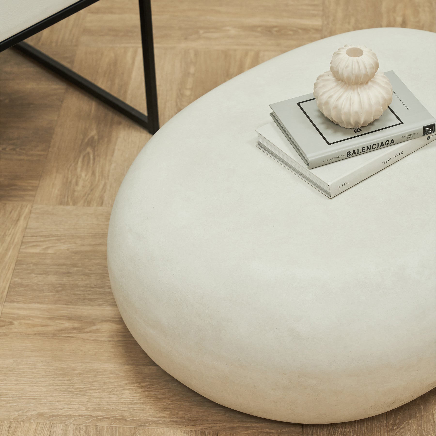 Minimal Concrete Pebble Coffee Table Large beside chair