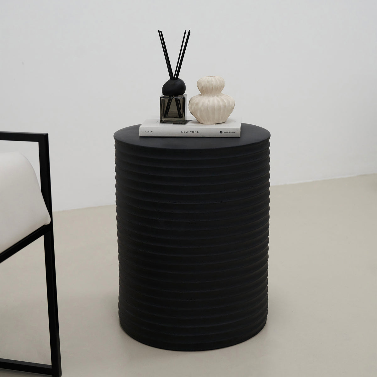 Minimal Onyx Ribbed Side Table beside chair