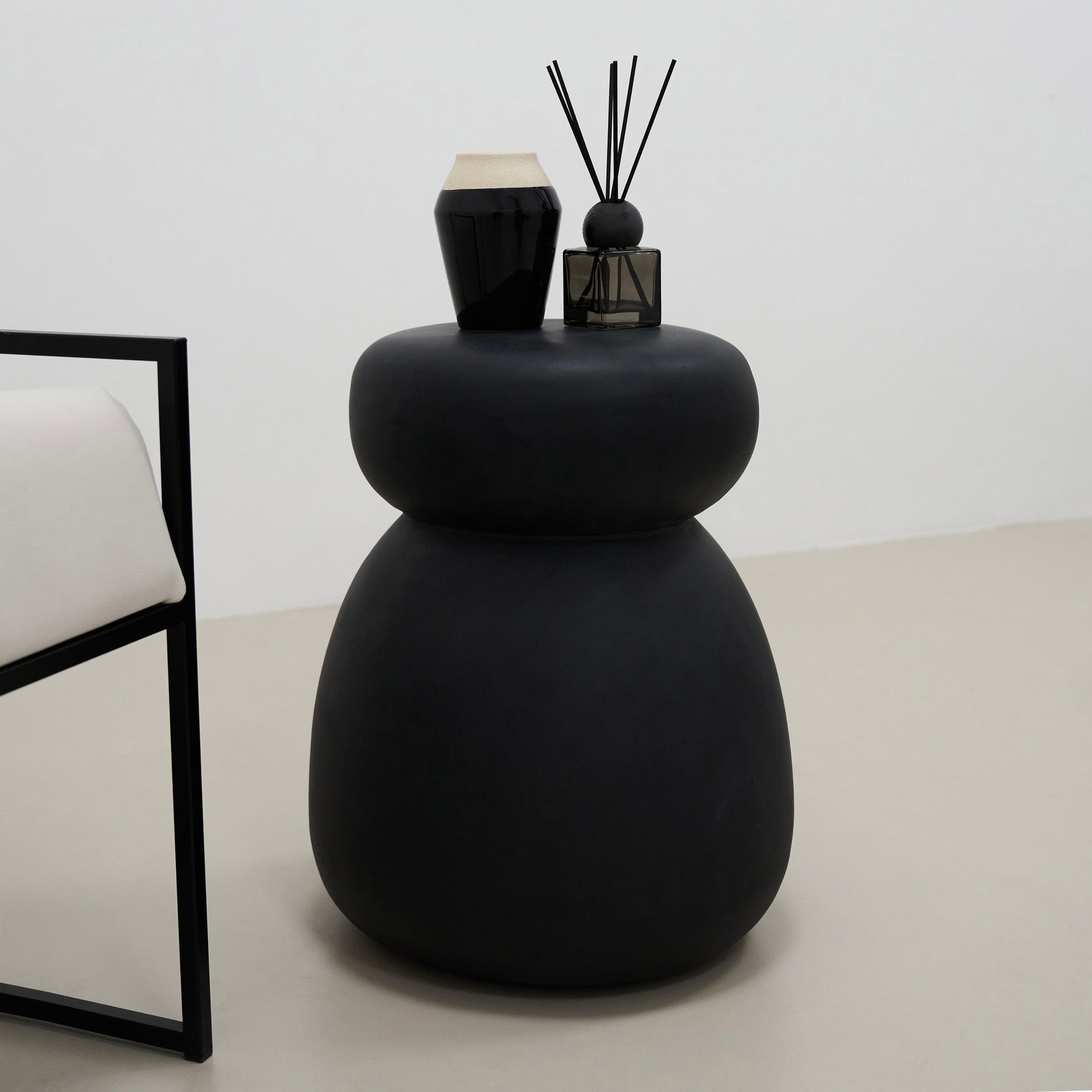 Minimal Onyx Side Table decorated with ceramics and incense