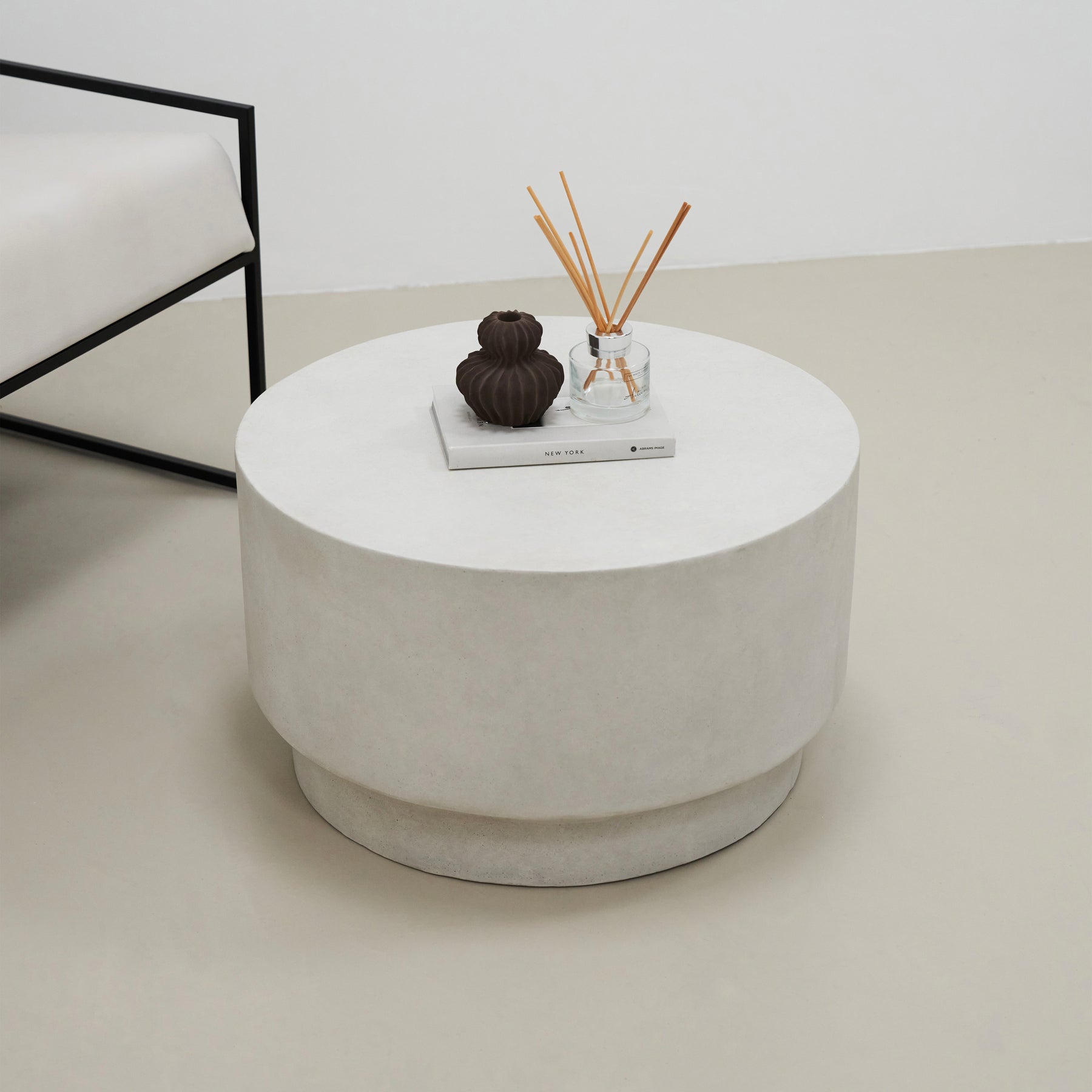Minimalist concrete round coffee table displayed in living room