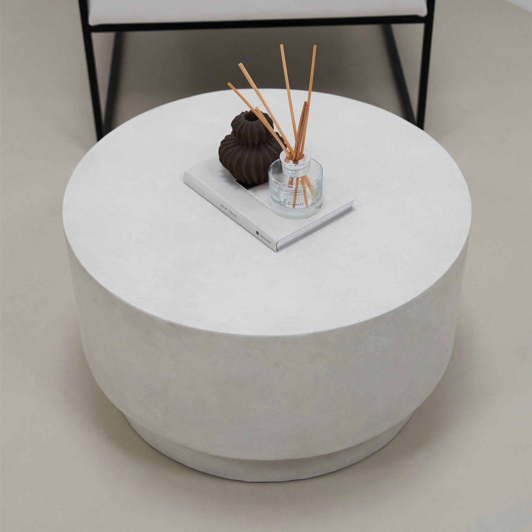 Minimalist white concrete round coffee table