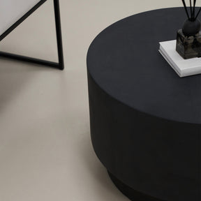 Closeup of Minimalist round black coffee table