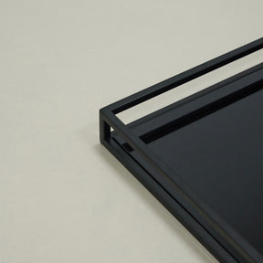 Detail shot of Black modern large rectangle tinted mirrored decorative tray corner