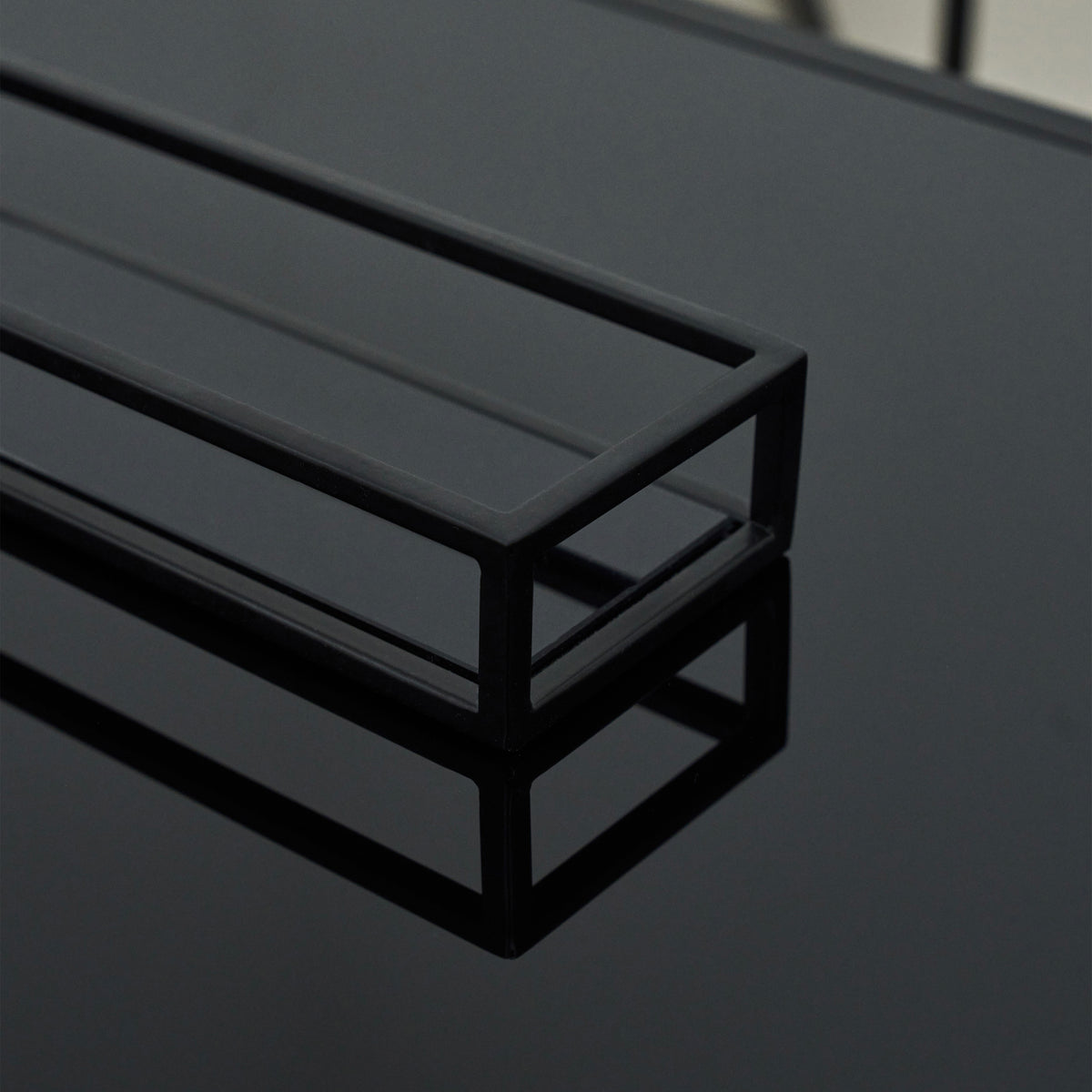 Detail shot of Black modern large rectangle tinted mirrored decorative tray corner