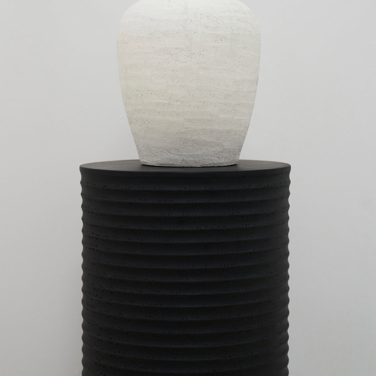 detail shot of vase on Minimal Onyx Ribbed Plinth