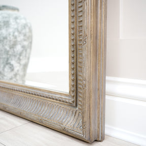 Closeup of large washed wood rectangular mirror