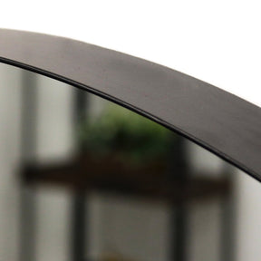 Full length arched black large metal mirror closeup