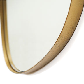 Gold metal stone shaped irregular wall mirror closeup