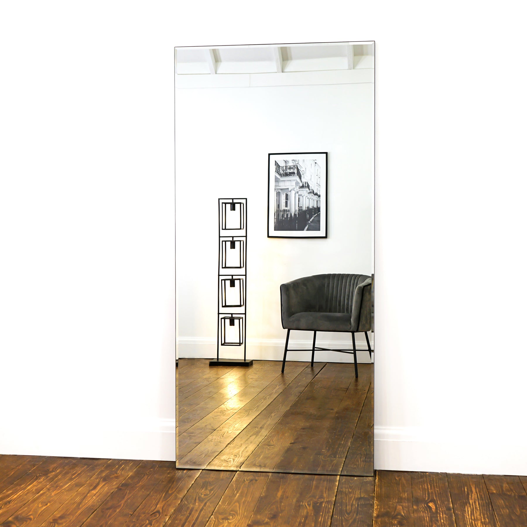 Large Frameless Full Length Rectangular Mirror reflecting lounge