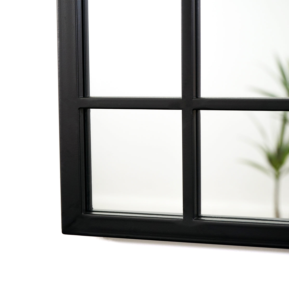 Black industrial rectangular metal mirror closeup