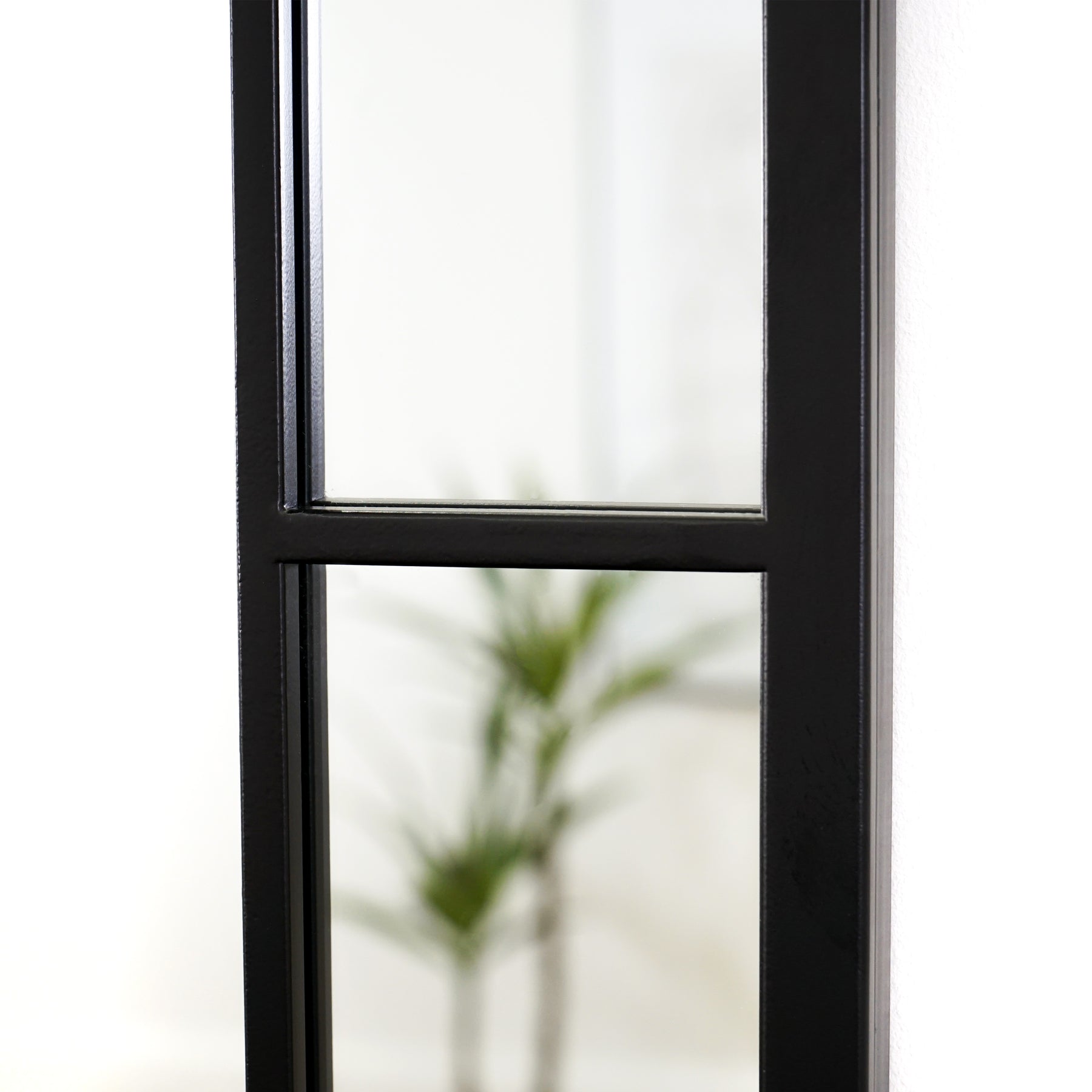 Black industrial rectangular metal mirror closeup