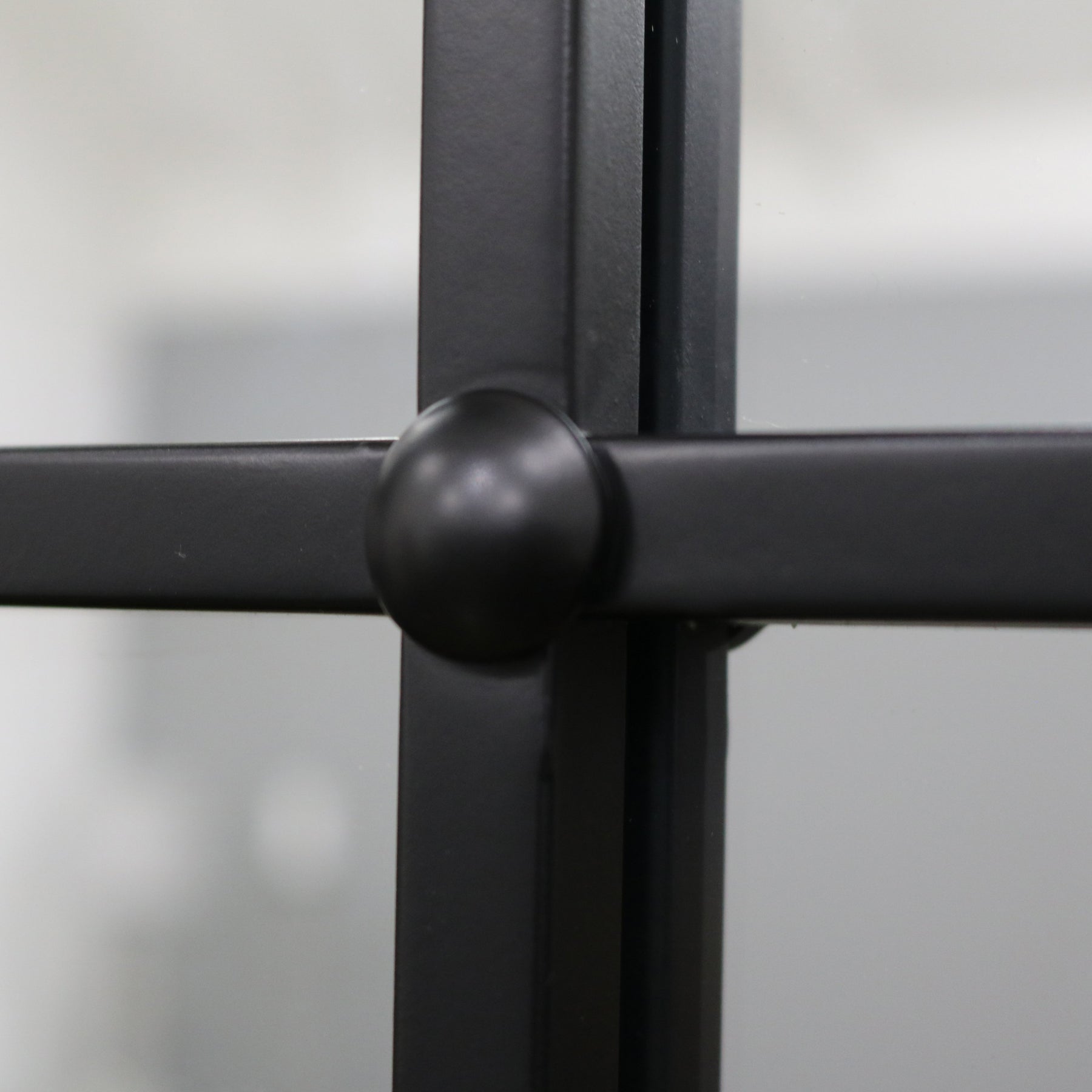 Closeup of Black Industrial Full Length Metal Mirror
