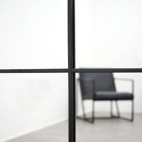 Closeup of Full length XXL black industrial metal window mirror