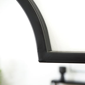 Full length black industrial arched metal mirror detail shot of arch