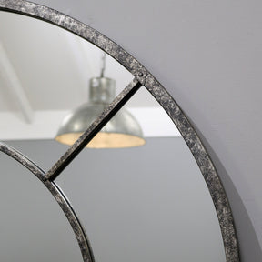 Crushed black industrial arched full length metal mirror detail shot of arch