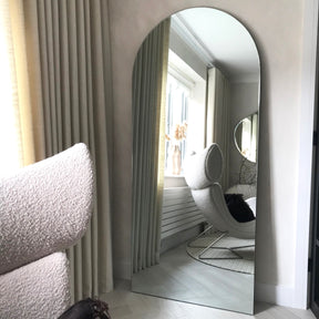 Large Frameless Arched Full Length Mirror reflecting natural light