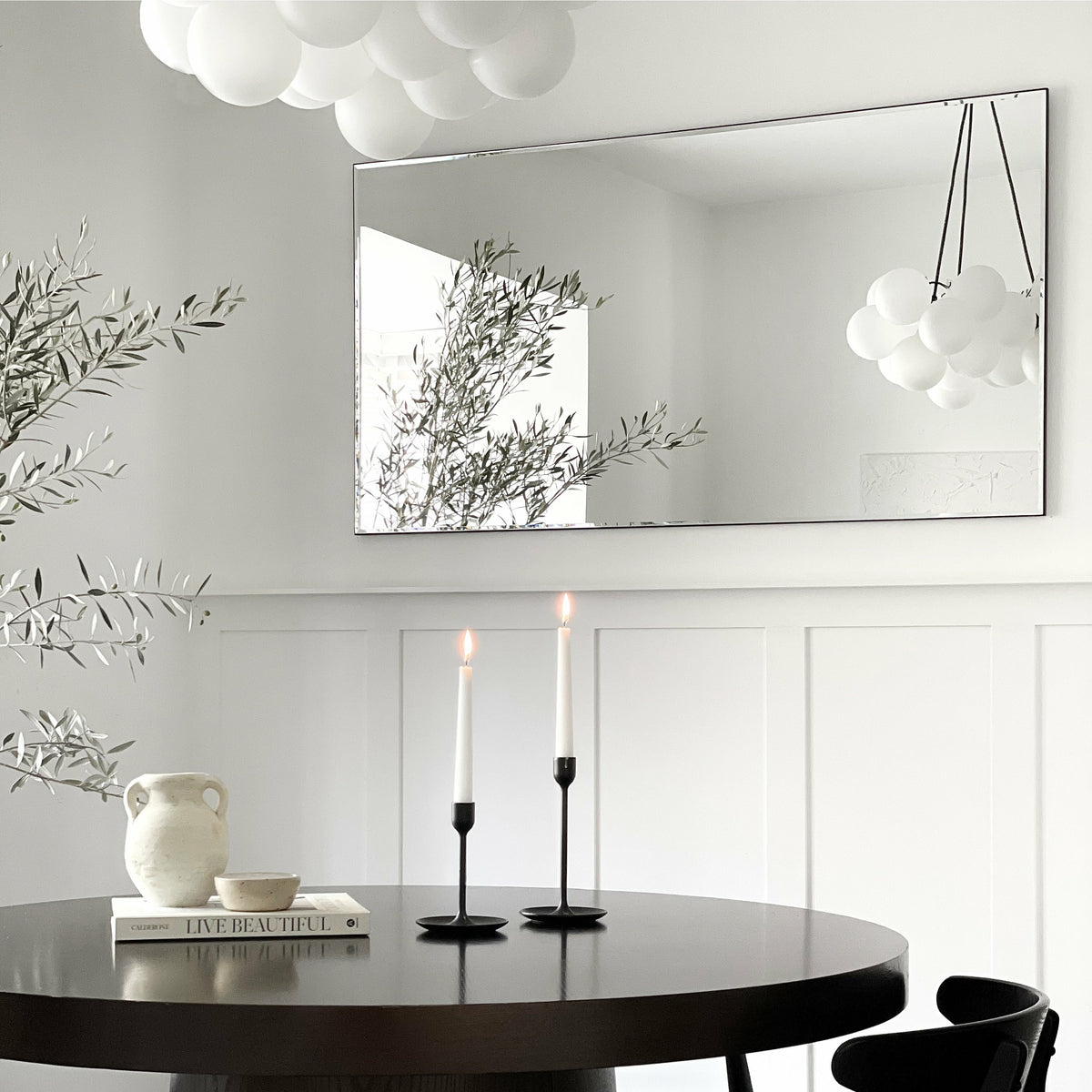 Large Frameless Rectangular Console Mirror displayed on wall above table