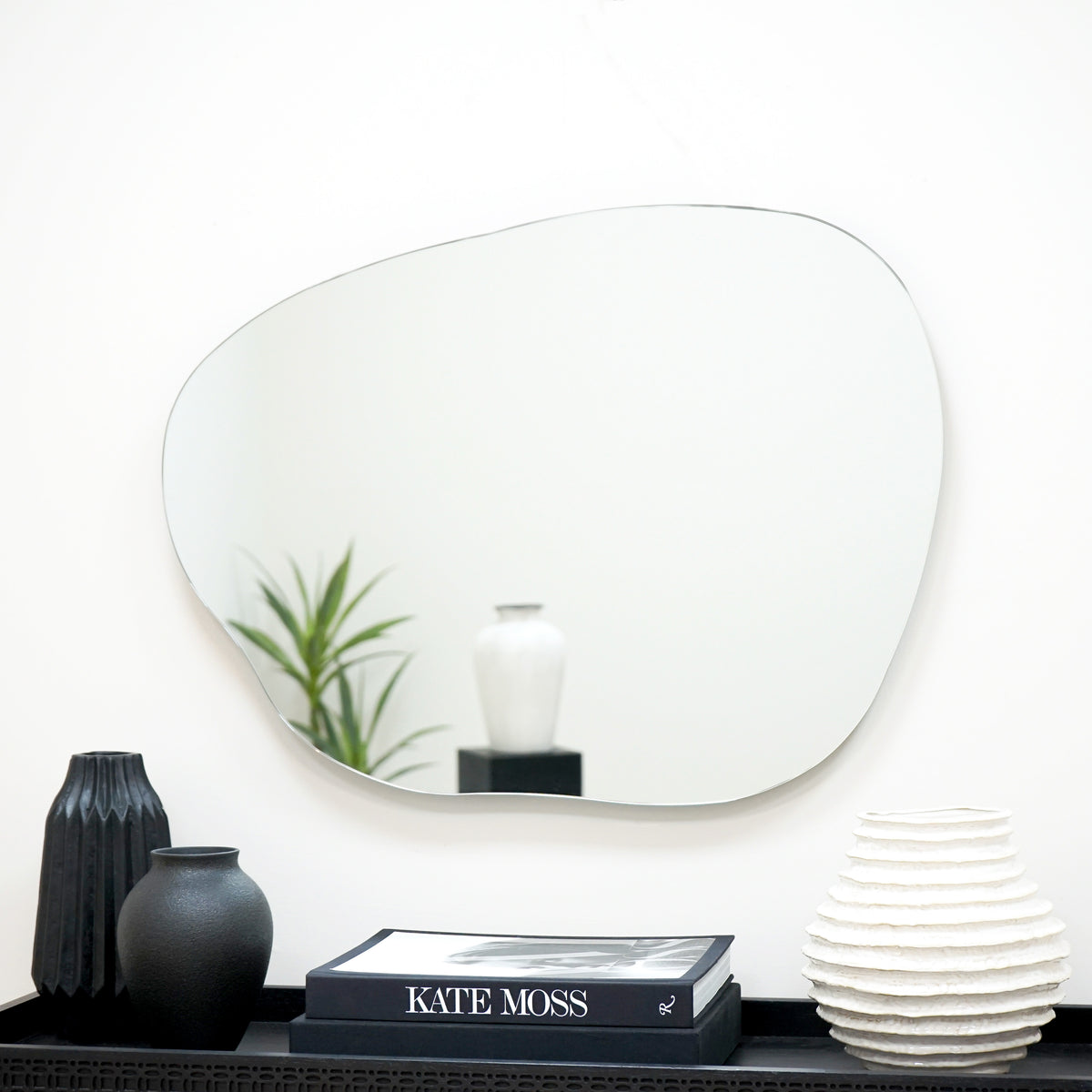 Small Frameless Pond Mirror displayed horizontally above console table