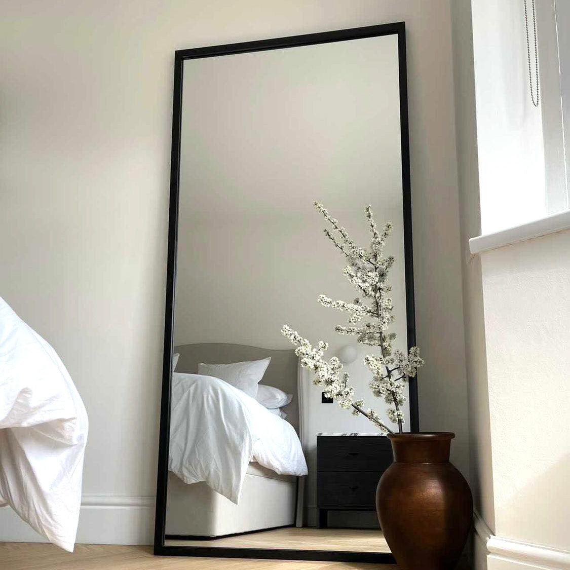 Full Length Black Industrial Metal Mirror as a bedroom lean to