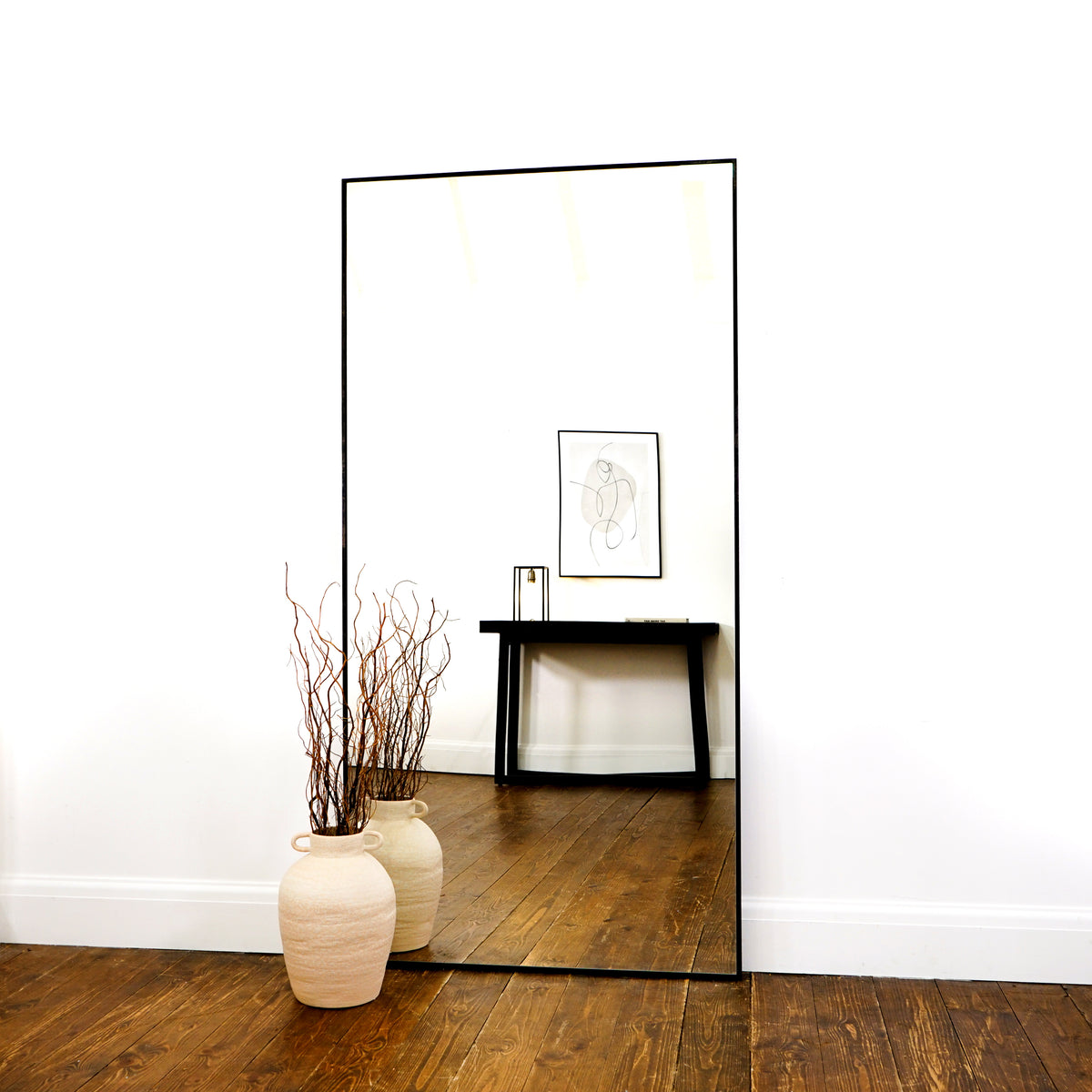 Full Length Extra Large Black Metal Mirror leaning against wall