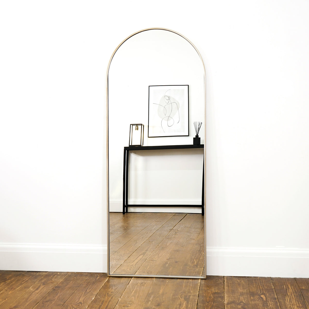 Full Length Champagne Large Arched Metal Mirror as a lean to